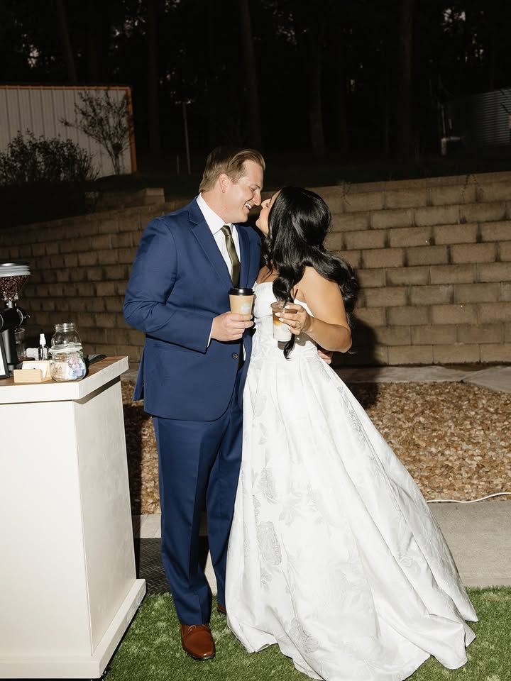 Wedding couple enjoying drinks from Cool Beans Coffee Cart